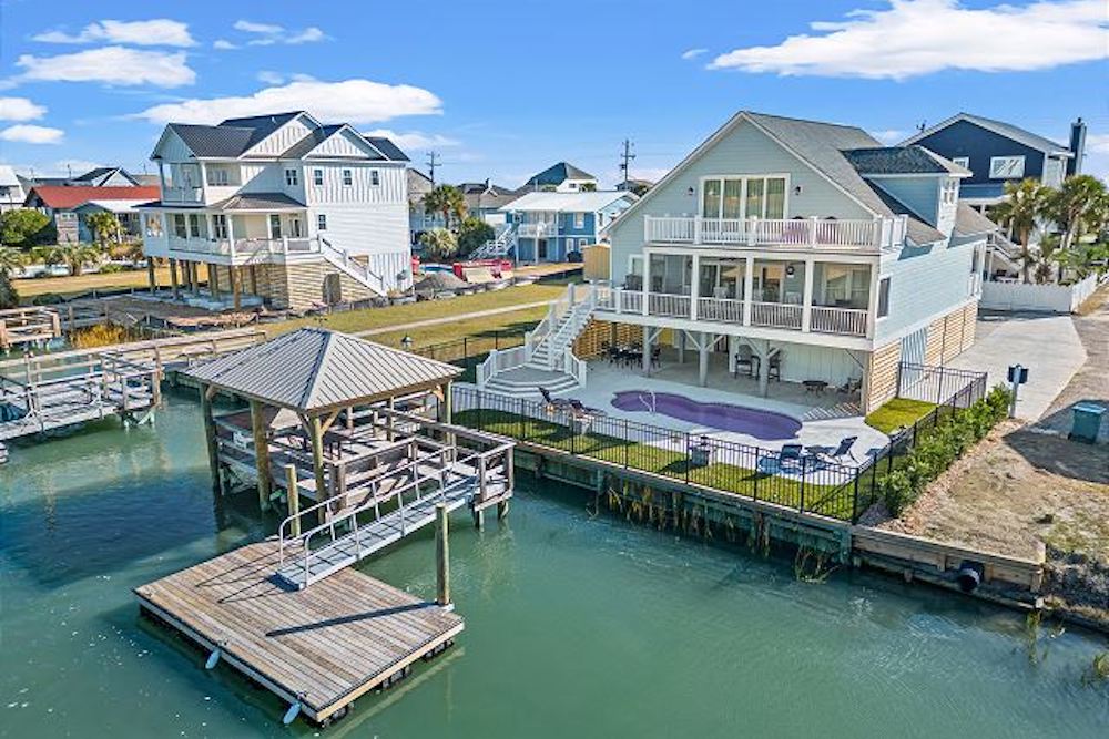 view of dock and pool at Best of Both vacation rental