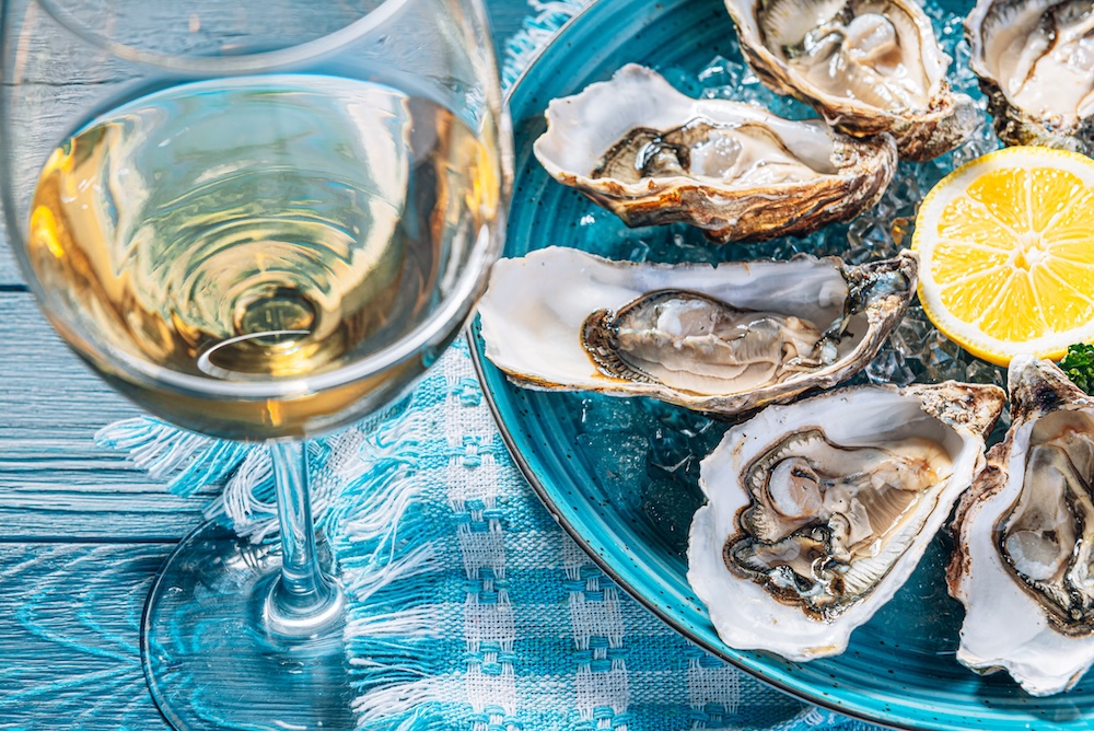 Fresh oysters with lemon ice and white wine.